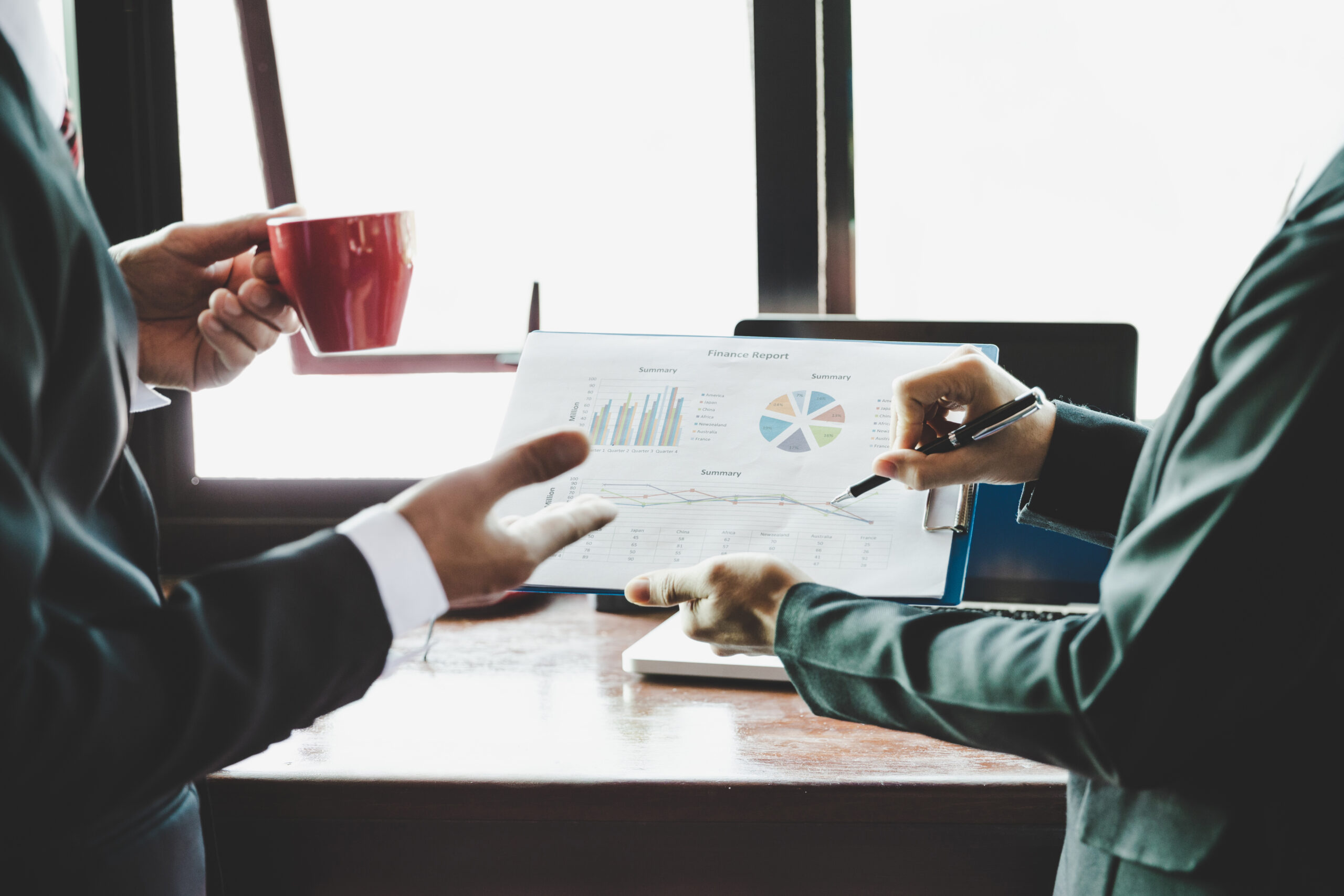 Landing Business Team Analyzing Income Charts Graphs Scaled